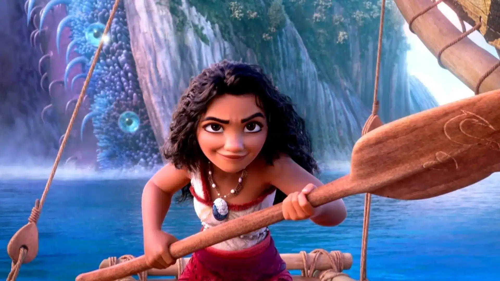 Moana navegando con una criatura marina de fondo