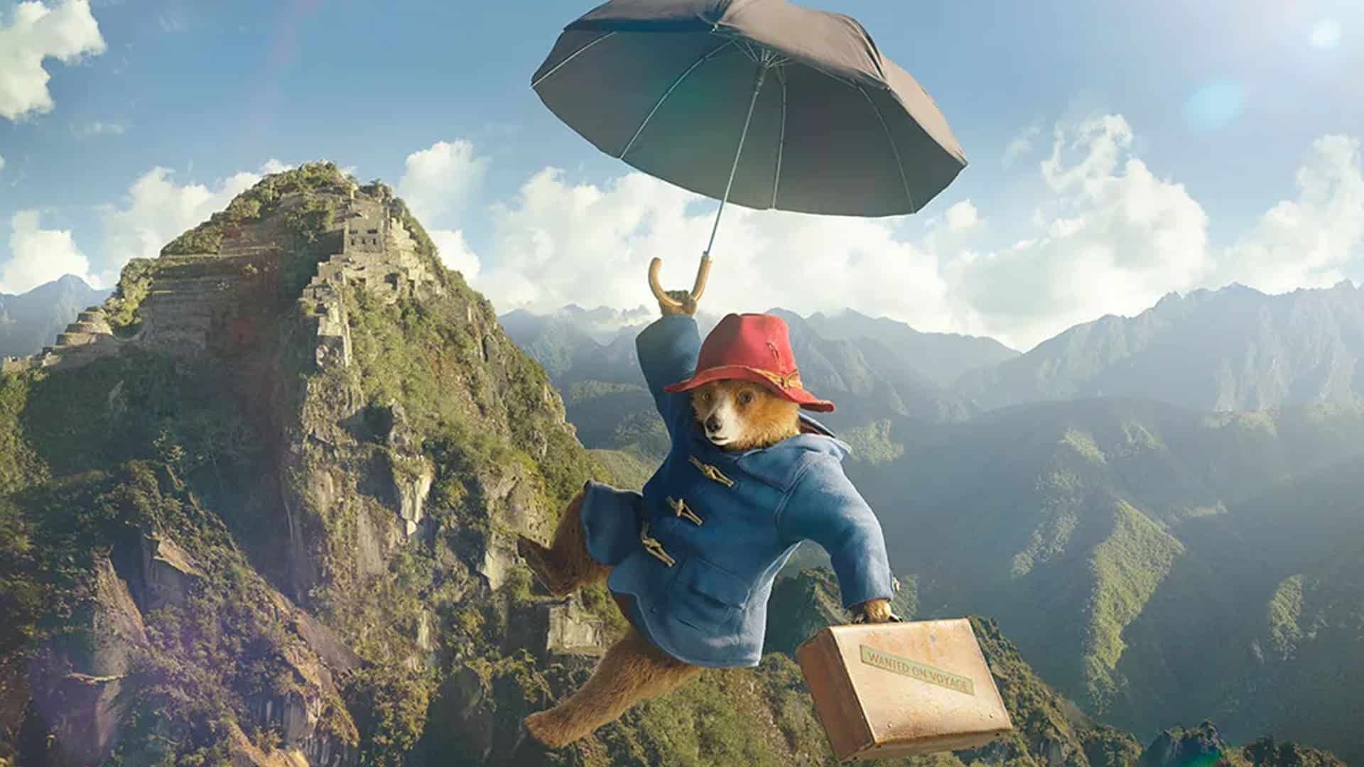 Paddington volando con una sombrilla