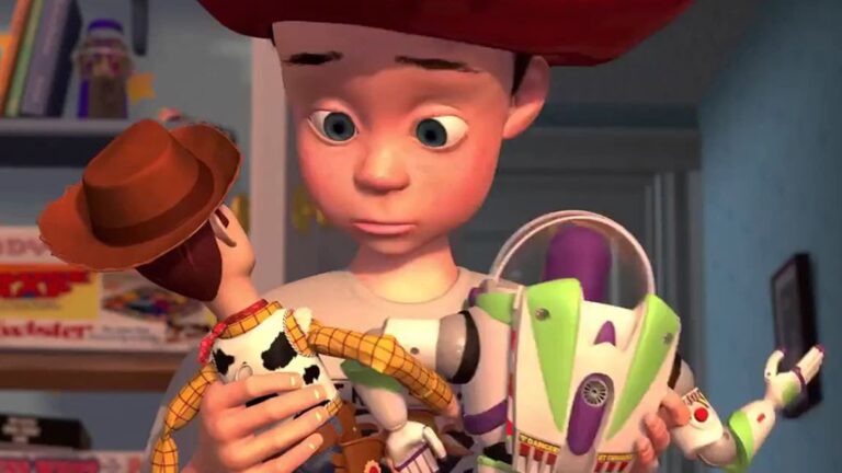 Andy niño con Woody y Buzz